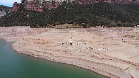 ruined church by the reservoir. aerial shot