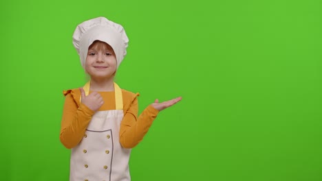 smiling little girl dressed as a chef