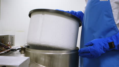 scientist opening lid of freezer in laboratory 4k