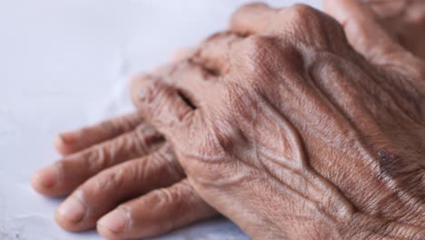 wrinkled hands of an elderly person