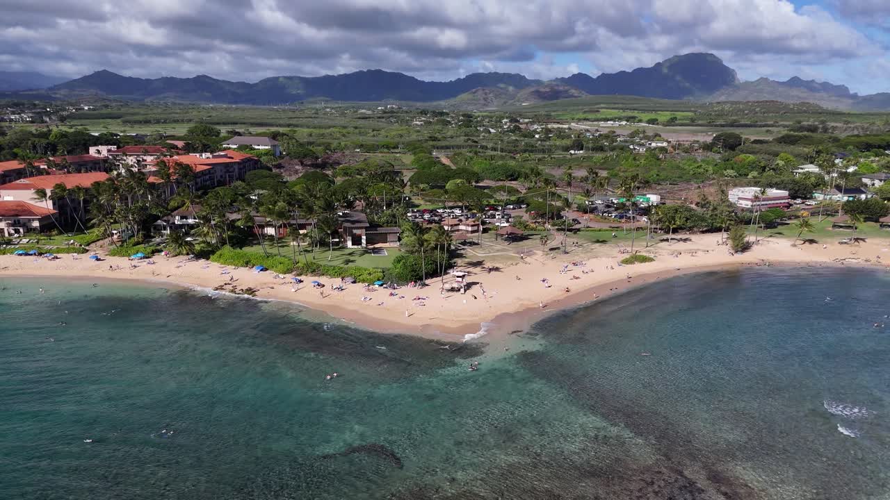 Drone aerial view of Kauai, Hawaii, showcasing lush mountains, tropical coastline, and ocean. Scenic island paradise with vibrant landscapes and natural beauty