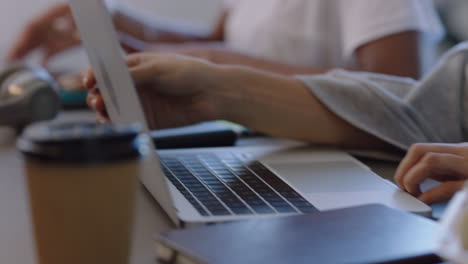 business woman hands using laptop computer viewing project on screen brainstorming in office boardroom meeting close up