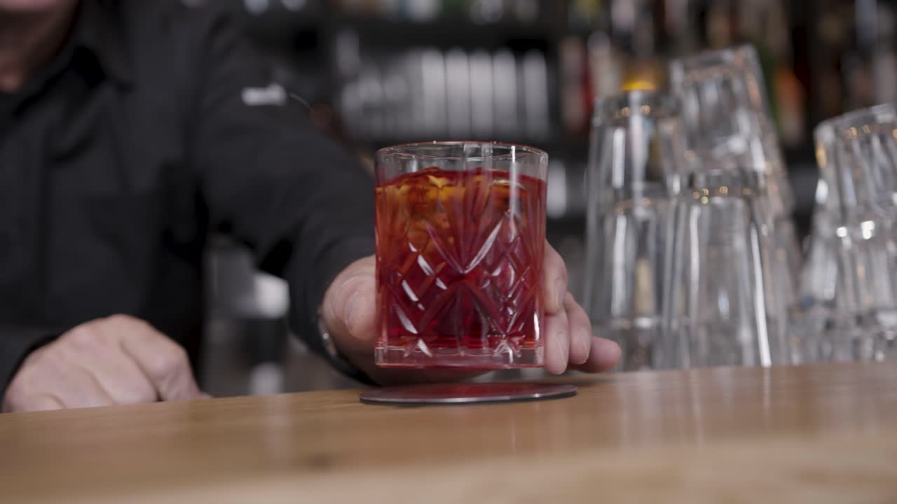 Barkeeper serving cocktail - drink