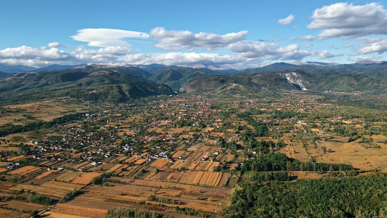 Aerial drone view of nature in Romania. Carpathian mountains, with a Baia de Fier village, greenery