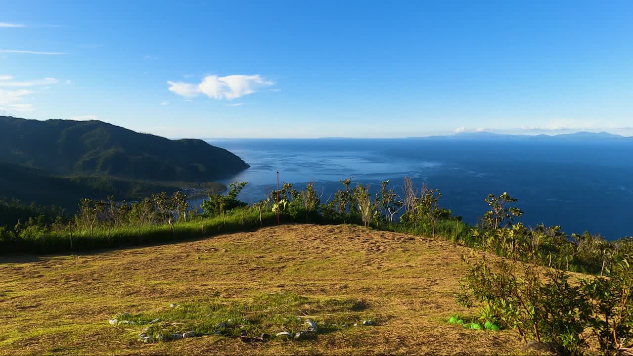 Serenity Of Nature With Tranquil Seascape View From The Hills Of Caningag In Philippines. Pan Right Shot
