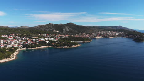 Orbit-drone-shot-of-a-small-town-on-the-coast-of-croatia