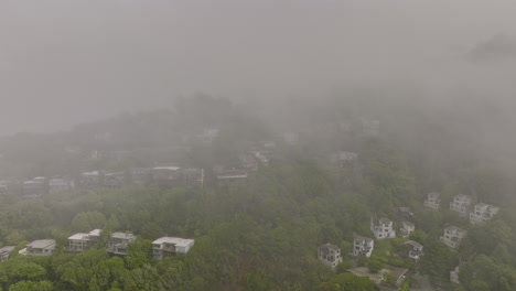 sausalito city california aerial v2 drone fly through clouds capturing foggy landscape of hillside residential neighborhood overlooking at richardson bay - shot with mavic 3 cine - june 2022