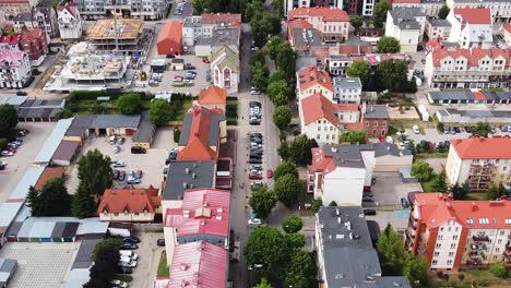 green alley surrounded with city buildings, aerial view