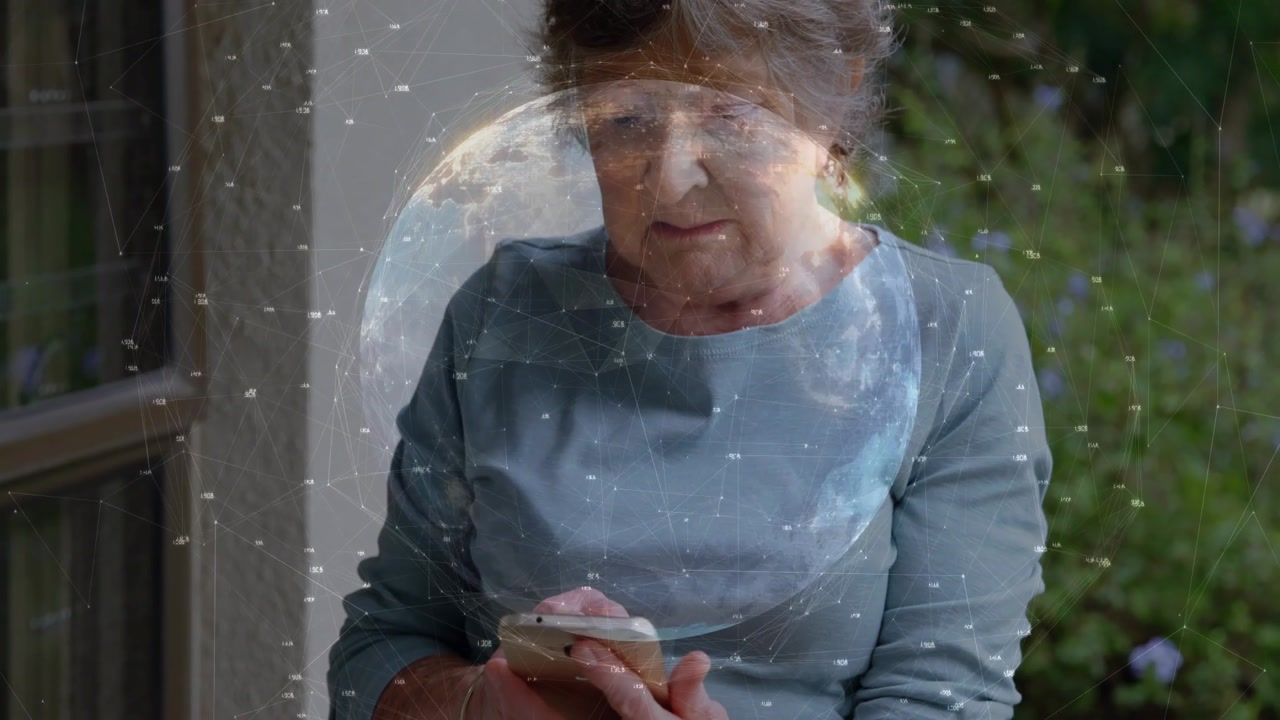 Senior woman tapping smartphone on porch, causing globe overlay centering on face, showcasing tech