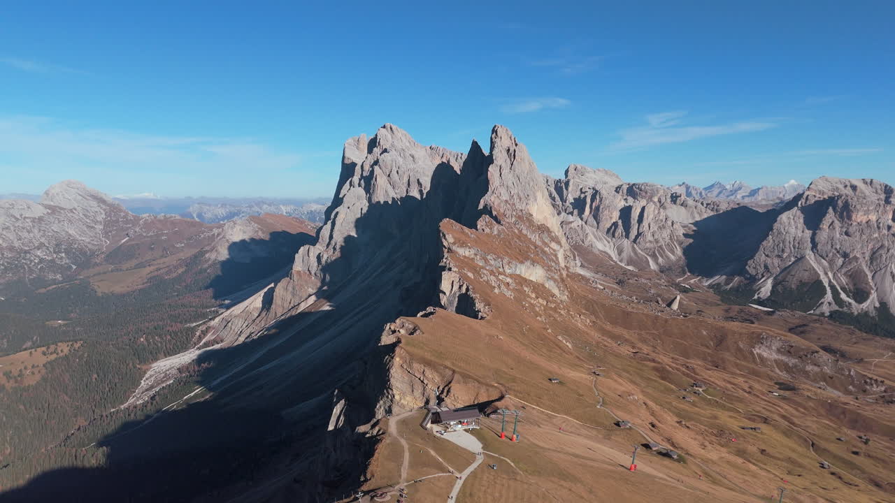 Drone pullback view from Seggiovia Fermeda chairlift and Seceda Ridgeline