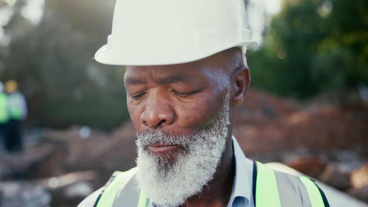 Construction worker using walkie talkie