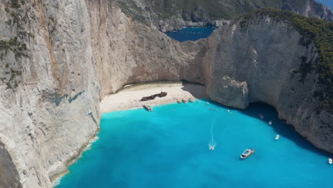 shipwreck beach - popular navagio beach for tourists during summer vacation in greece