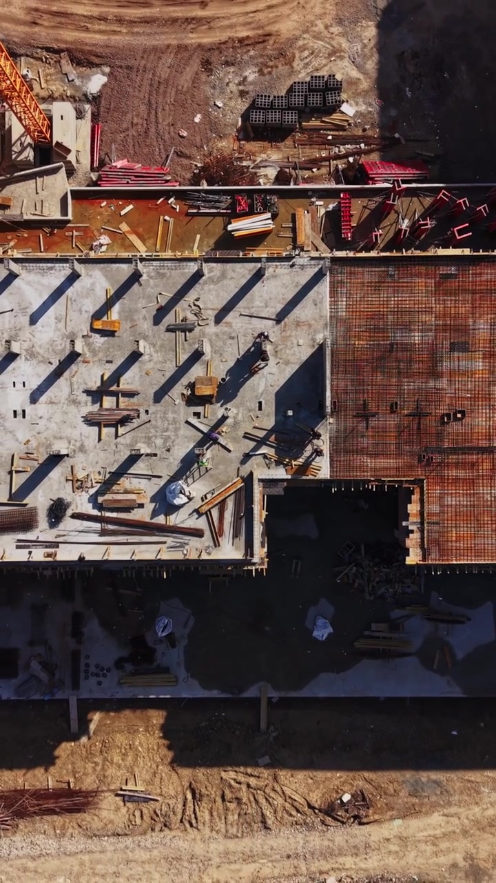 Top down view of concrete foundation and rebar mesh