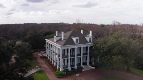 panning close-up aerial shot of the antebellum mansion dunleith in natchez, mississippi