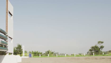 African American man jumping an obstacle with his Dressage horse