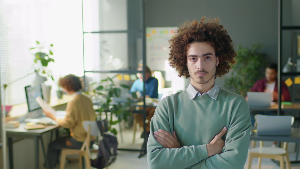 Portrait of Young Man Working in Office