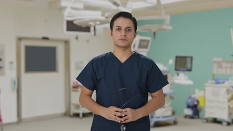 sad indian doctor removing stethoscope from shoulders