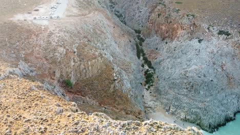 Rocky-valley-and-Seitan-Limania-beach,-aerial-view