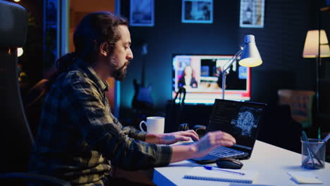 man in home office typing on keyboard, updating ai neural networks