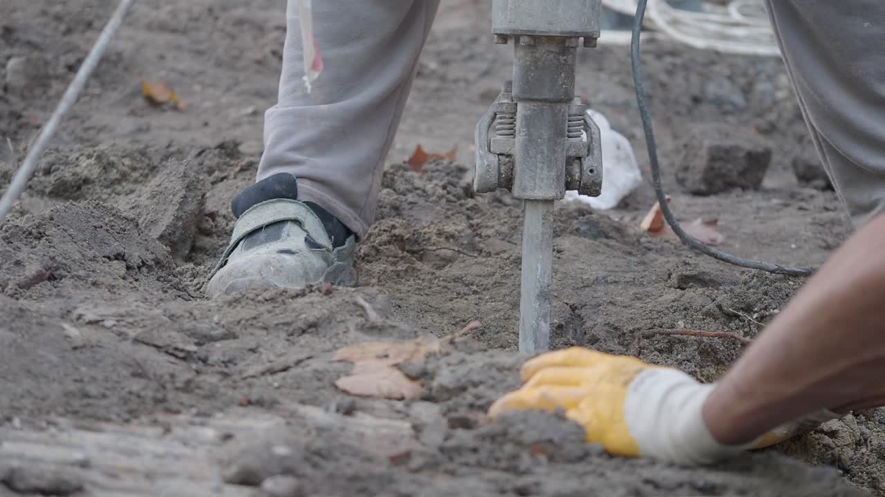 Construction worker using a jackhammer