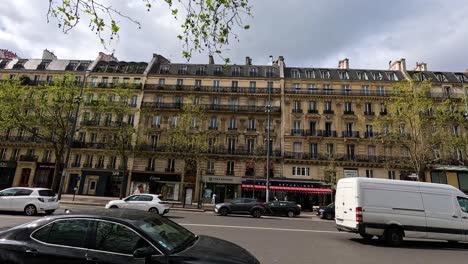 vans and cars moving on a paris street