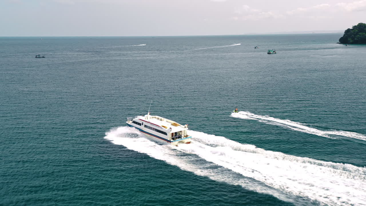 Tourist Speedboat And Jetski Travelling In Ocean, Aerial Tracking View.