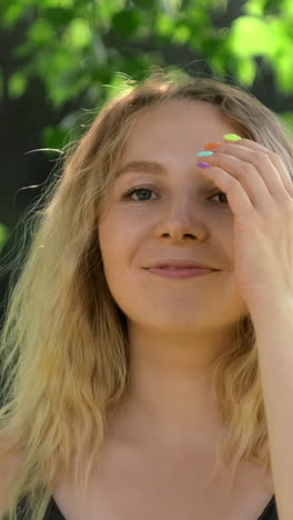 portrait of a young woman in a park