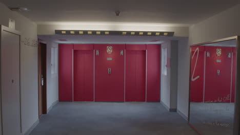 hotel corridor with red elevators