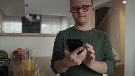 Tilt-up-of-caucasian-adult-caucasian-man-with-down-syndrome-taking-photo-of-prepared-breakfast.