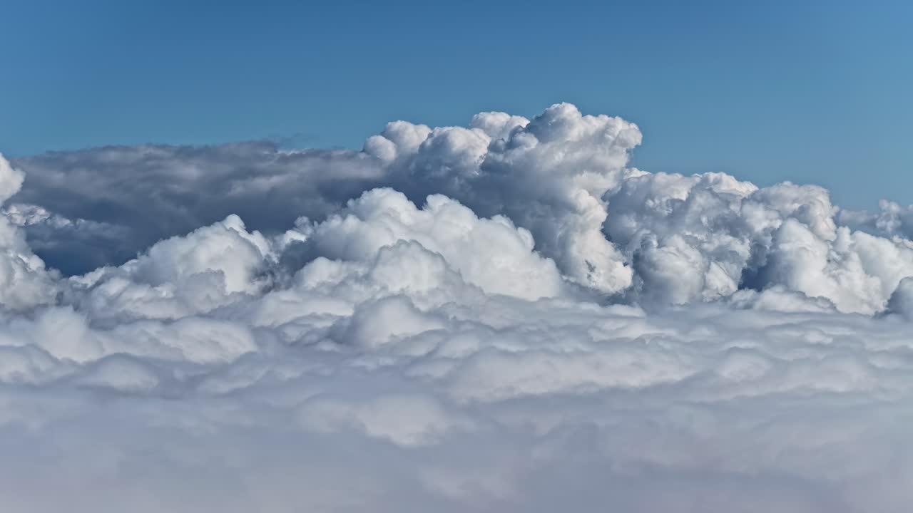 Majestic clouds rolling across the sky in a serene and tranquil scene