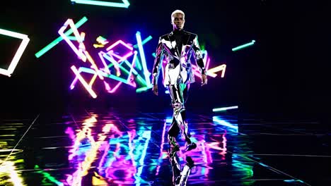 fashion show model in metallic suit under neon lights