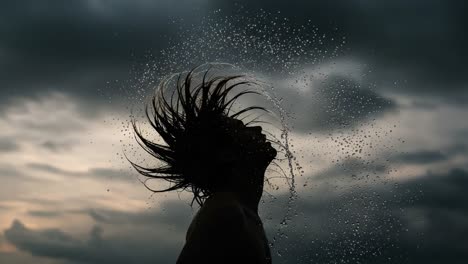 dynamic water splashing around silhouette against moody sky, highlighting the energy and freedom of movement in a playful water scene