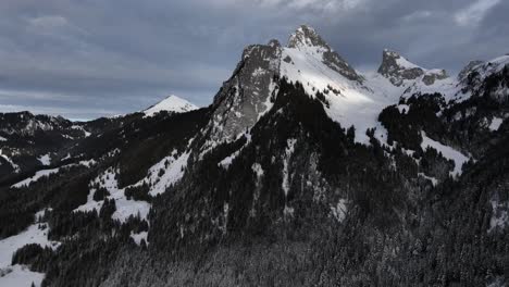 Aerial-view-of-epic-montain-with-snow-and-pines-valley,-French-Alps,-Dent-d'Oche