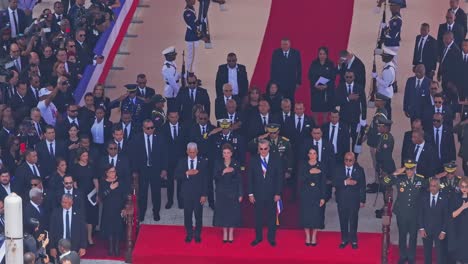 solemn official ceremony with dignitaries and military personnel