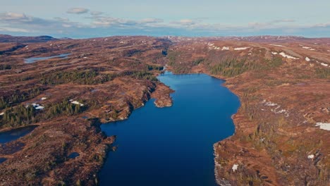 panoramic view over reinsjoen lake in norway - drone shot