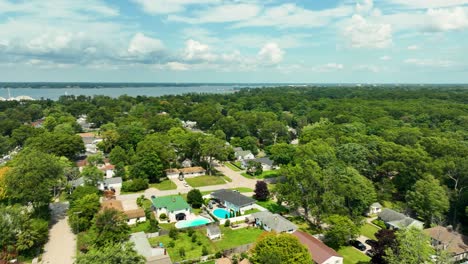 aerial view of a suburban neighborhood with lush green trees and houses