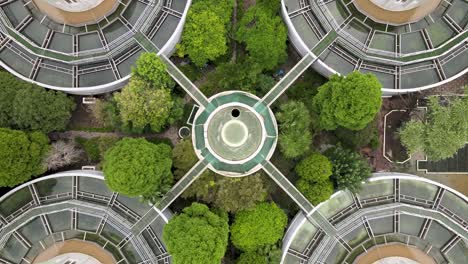 drone aerial view of sewage water treatment plant with storage tanks, trees