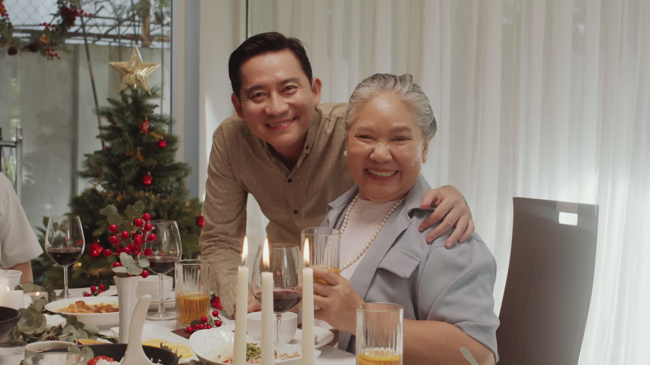 Portrait of Adult Son and His Mother Celebrating Christmas