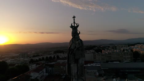 church statue at sunset city of braga in portugal aerial view