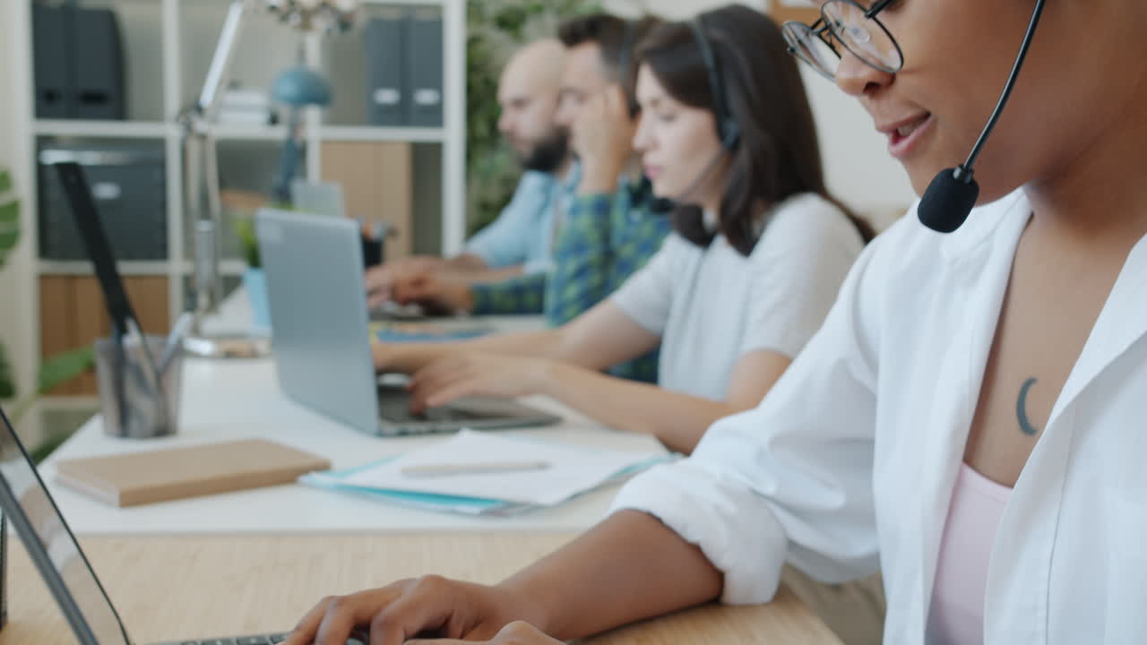 People Working on Laptops in an Office