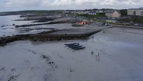 Aerial-parallax-orbit-around-currach-boat-at-ladies-beach-galway-ireland