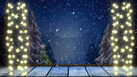 animación de luces de hadas de navidad y nieve cayendo sobre el paisaje de invierno