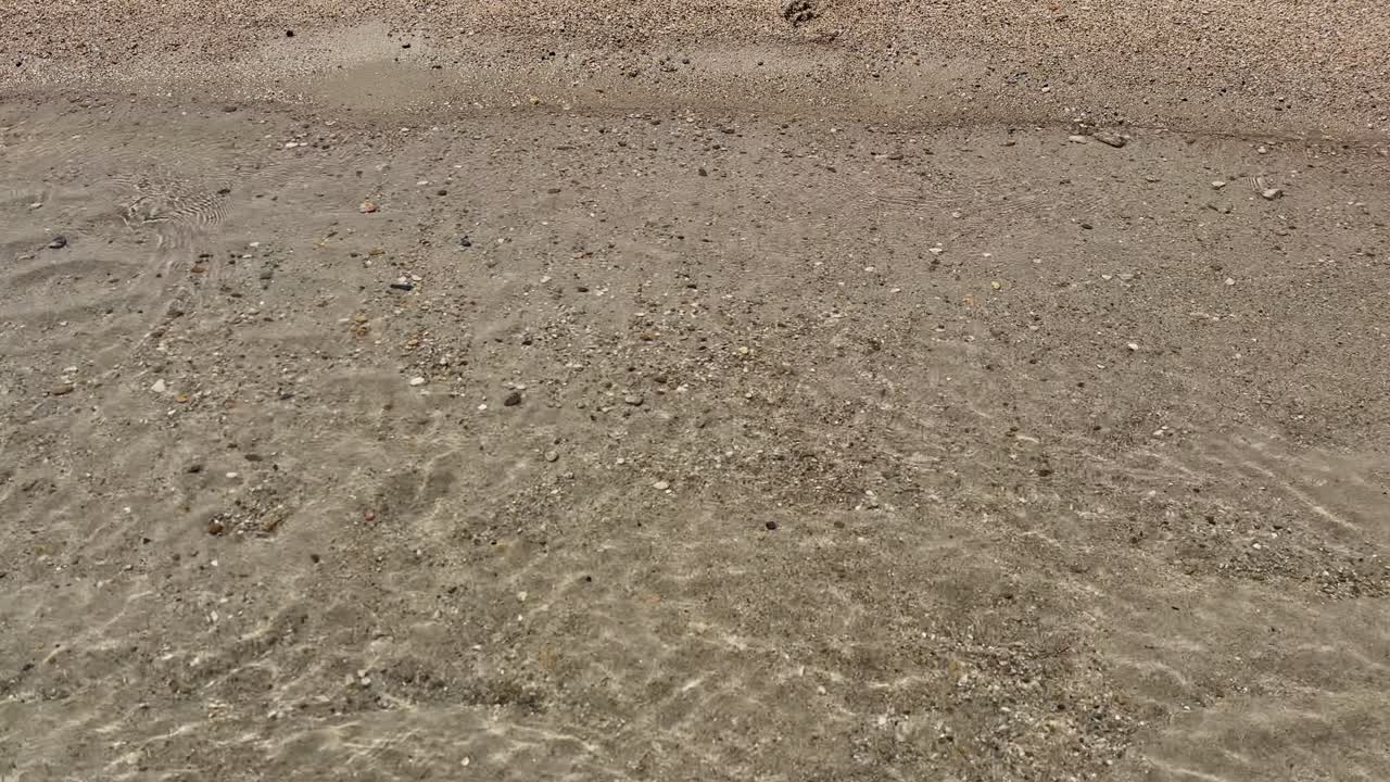 Stunning beach scene in Halkidiki, Greece, with elegant sunbeds facing the crystal-clear turquoise sea. A perfect summer escape in the heart of the Aegean.