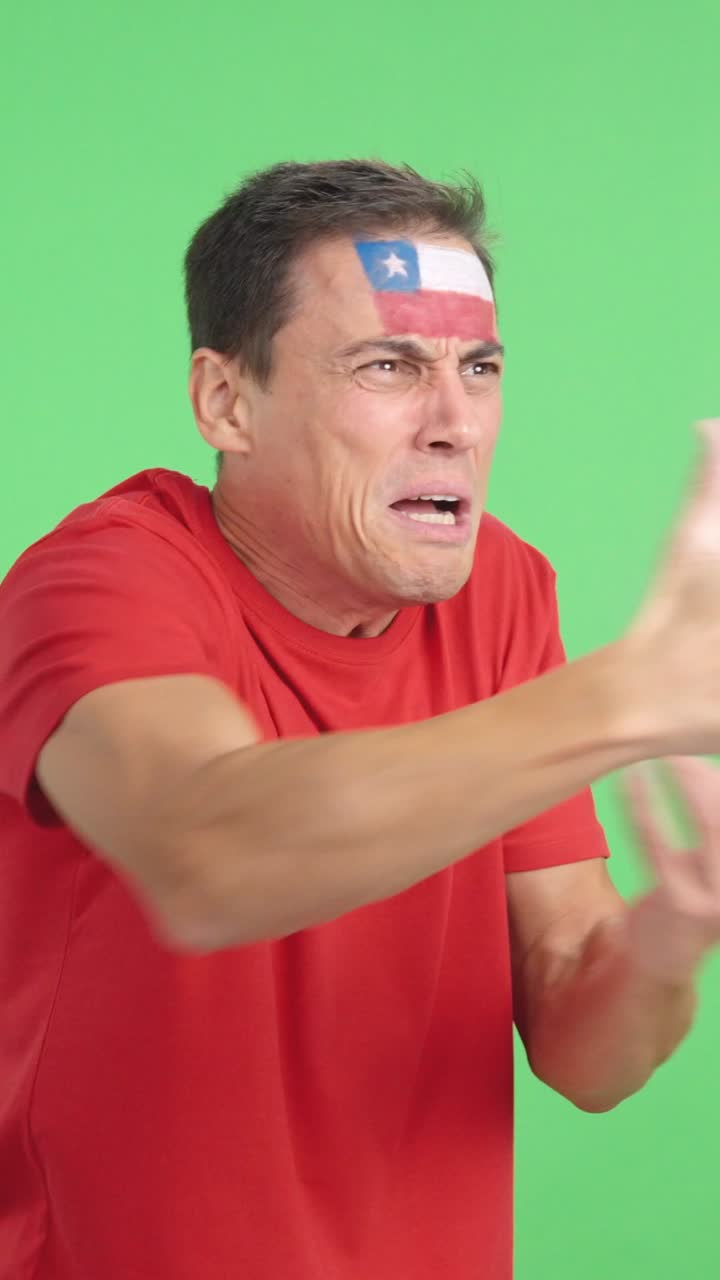 Man cheering for Chile, angry with the decision of referee