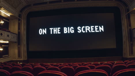 empty movie theater with 'on the big screen' displayed