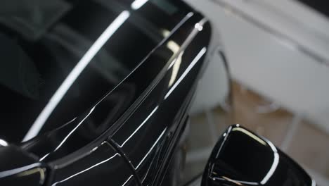 close-up of a black car's polished body