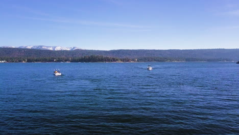 leisure boats floating on freshwater of big bear lake in america on summer day