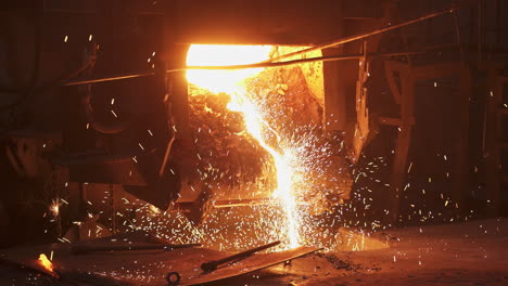 molten metal pouring from furnace