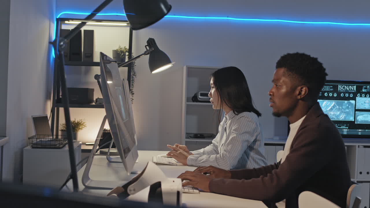 Engineers Working on Computers in Office