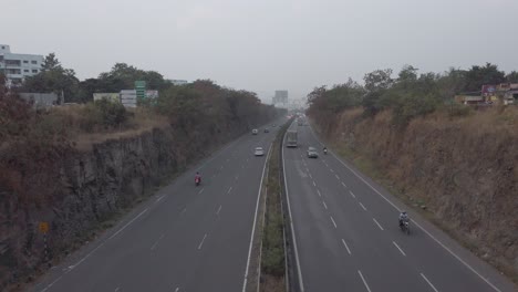 Multi-lane-Mumbai-Bangalore-highway-traffic-near-Pune,-road-travel-in-India